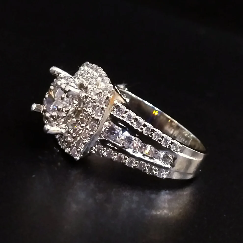 Diamond-cut-solitaire-ring-with-white-gold-plated2.webp